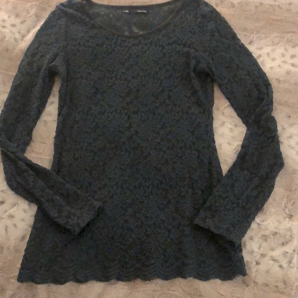 Lacy top. Deep/rich green. Scalloped details at bottom. Black trim at neck.